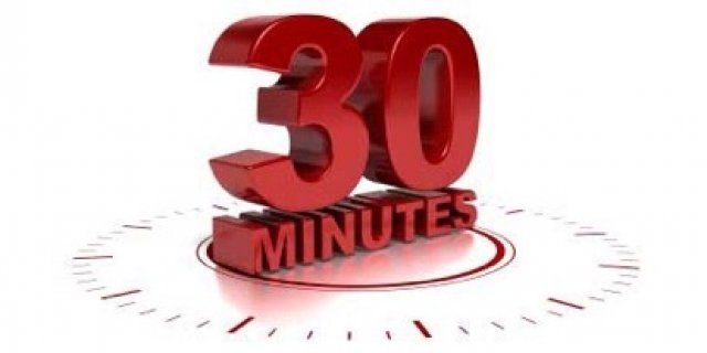 A clock with the words 30 minutes on it