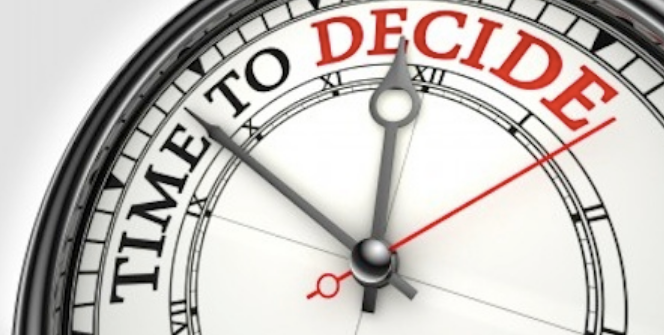 A clock with the words time to decide on it