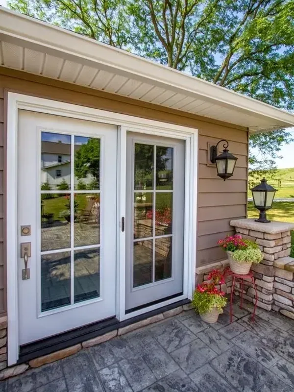 A house with a patio and a sliding glass door installation & replacement services in Damascus, AR photo
