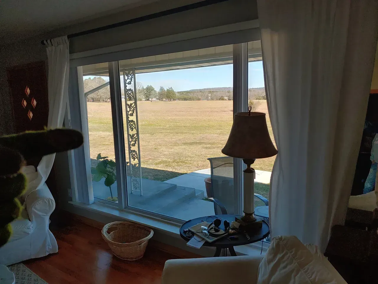 A living room with a large window replacement service in Damascus, AR photo