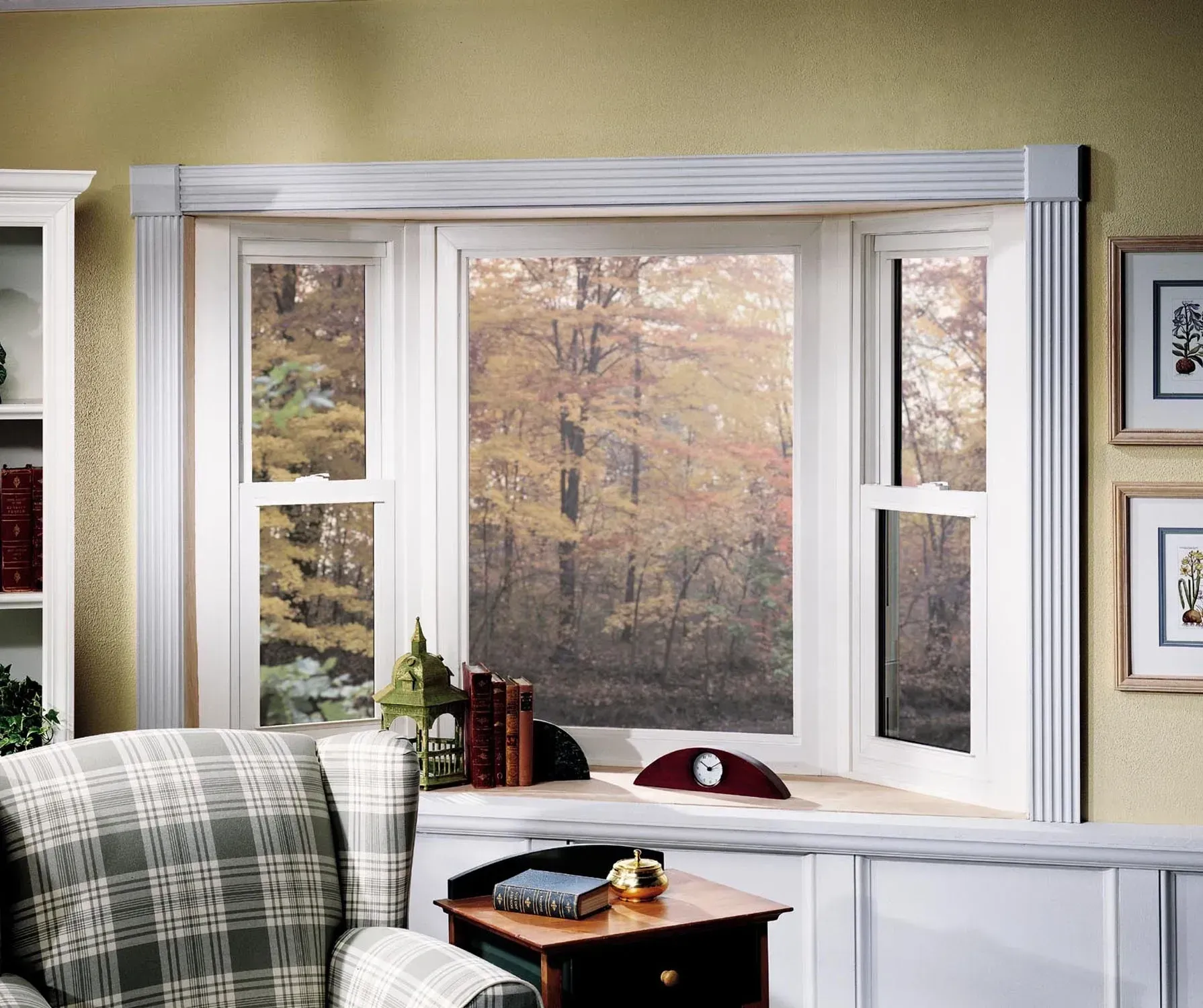 A living room with a large window and a chair