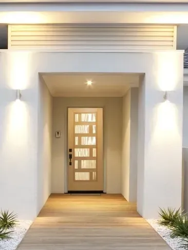 The front door of a house with a wooden walkway leading to it.