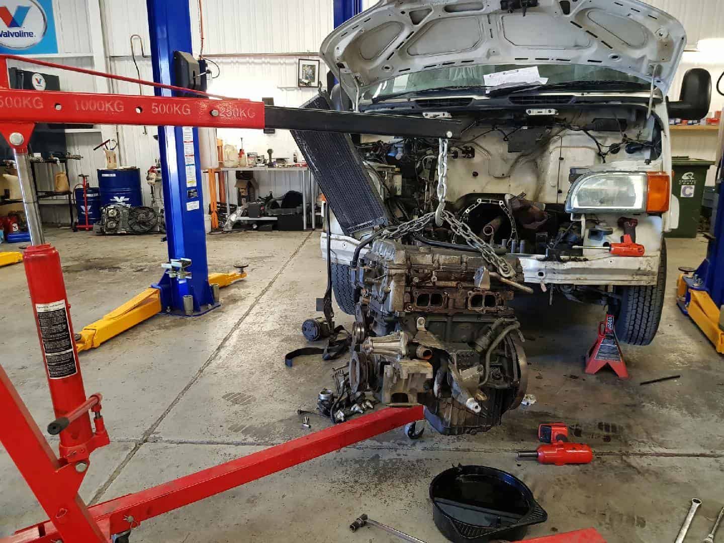 A Car Engine Is Being Checked In A Vehicle In A Garage — Sojos Mechanical & Tyre Service In West Gosford, NSW