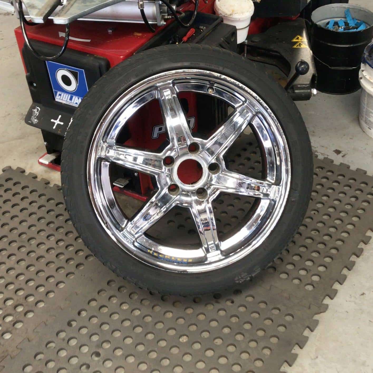 A Chrome Wheel With A Black Tire On It — Sojos Mechanical & Tyre Service In Kariong, NSW