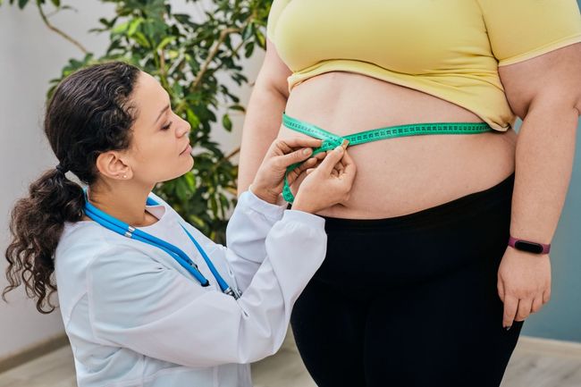 A Doctor Is Measuring A Woman 's Waist — Great Bends, KS — Innovative Wellness