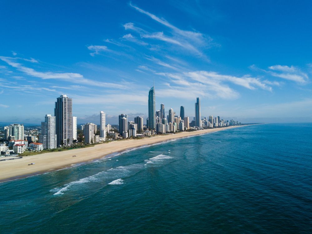Aerial View of a Coastal Skyline With Tall Buildings Beside a Sandy Beach — Accredited Training in Gold Coast, QLD