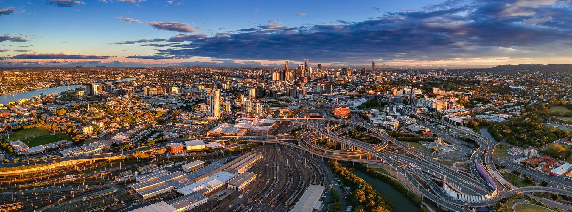 Aerial View of a City Skyline at Sunset With Dense Buildings — Accredited Training in Brisbane, QLD