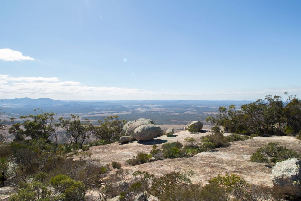 Rocky Hilltop Overlooking a Distant City Under a Clear Blue Sky — Accredited Training in North Burnett, QLD