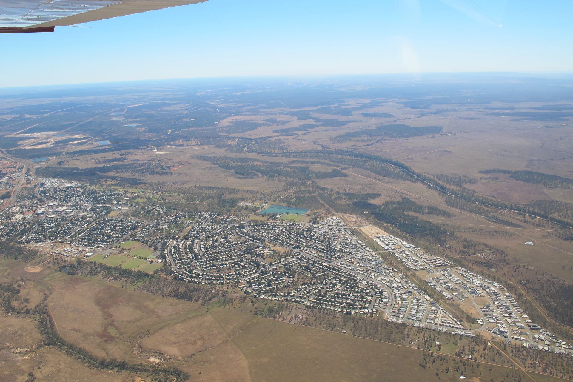 Aerial View of a Small Town Amid Brown Farmland and Open Plains — Accredited Training in Isaac, QLD