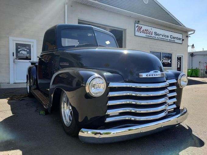 Black Car — Milford, CT — Mattie’s Service Center Black classic Chevrolet pickup truck parked in front of