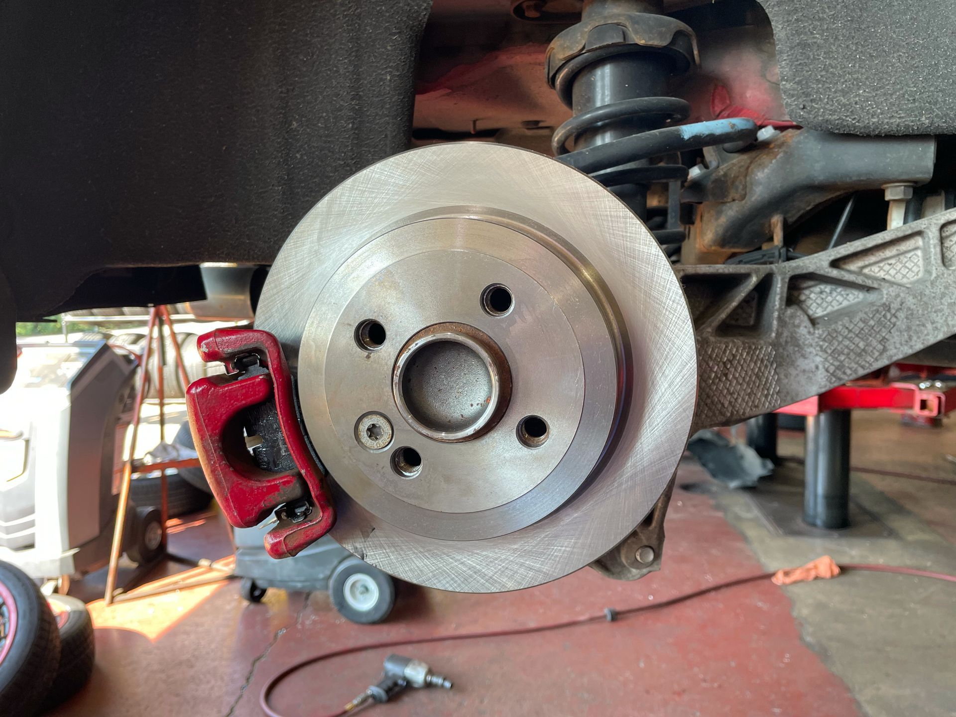 Fresh pads and rotors installed on a mini cooper at Jamie's Tire & Service