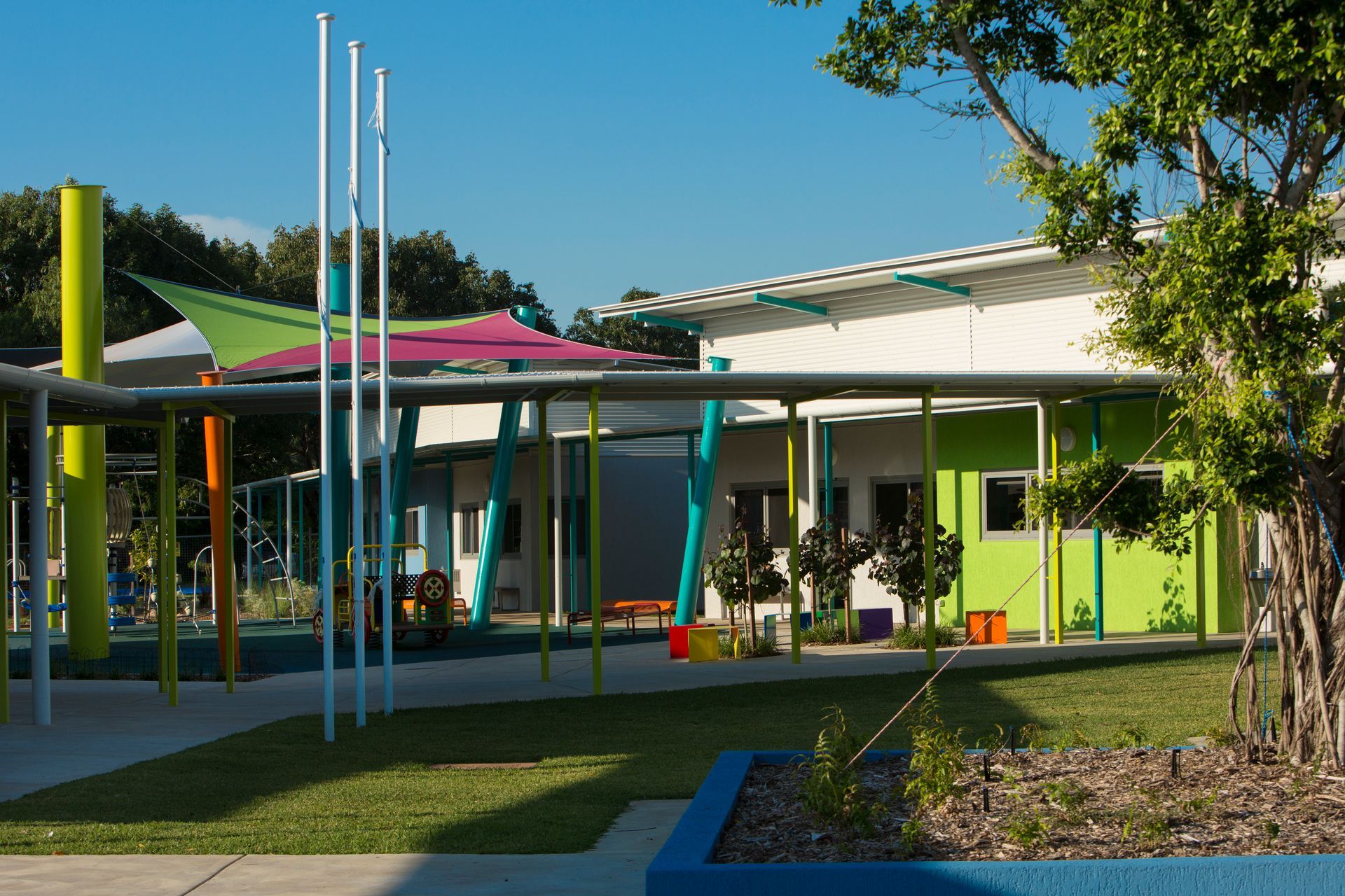 A building with a lot of colorful umbrellas in front of it