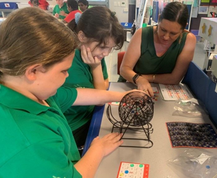 A group of people are playing a game of bingo
