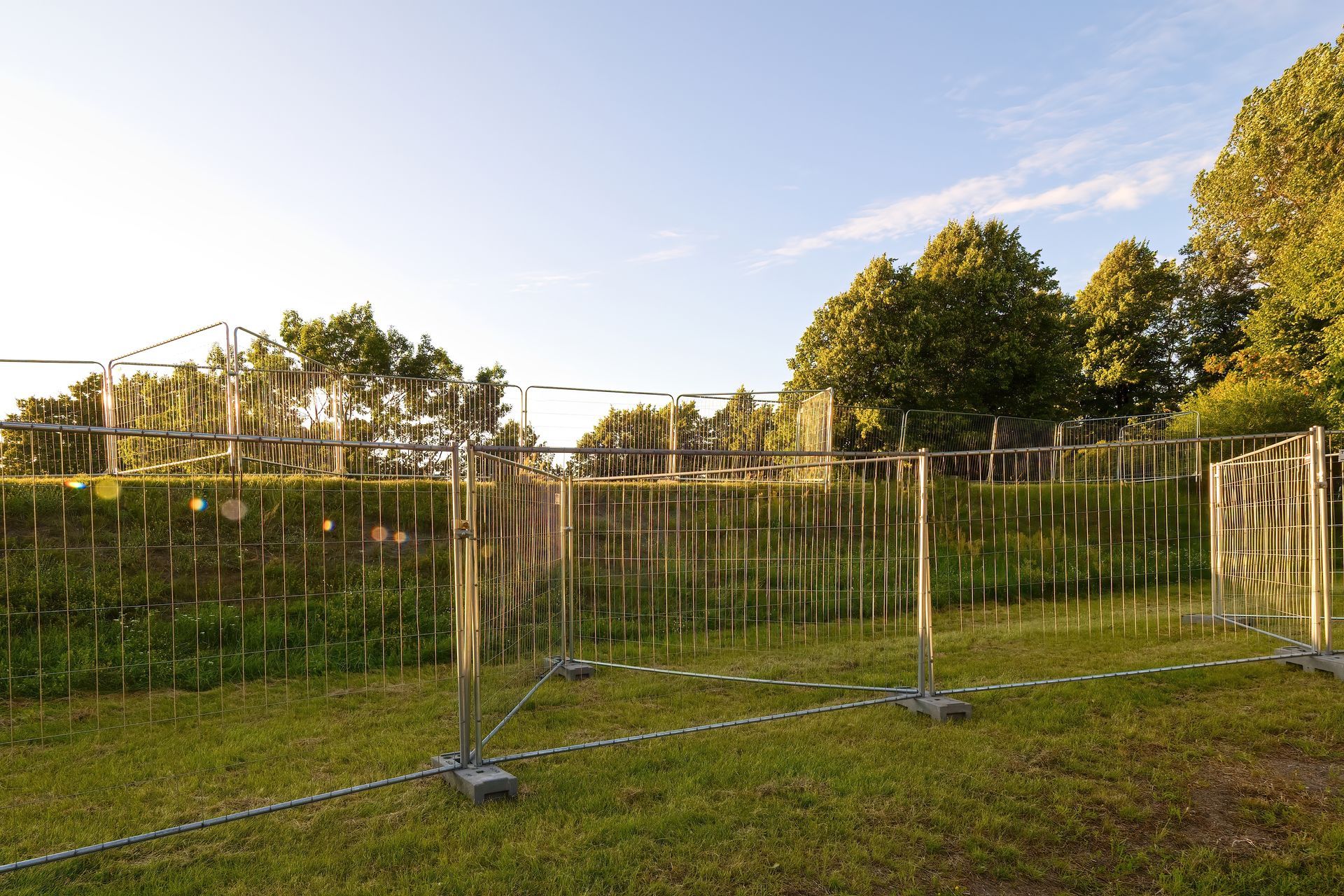 Metal Barriers on Green Grass — Metal Fencing Supplies In Wingham, NSW