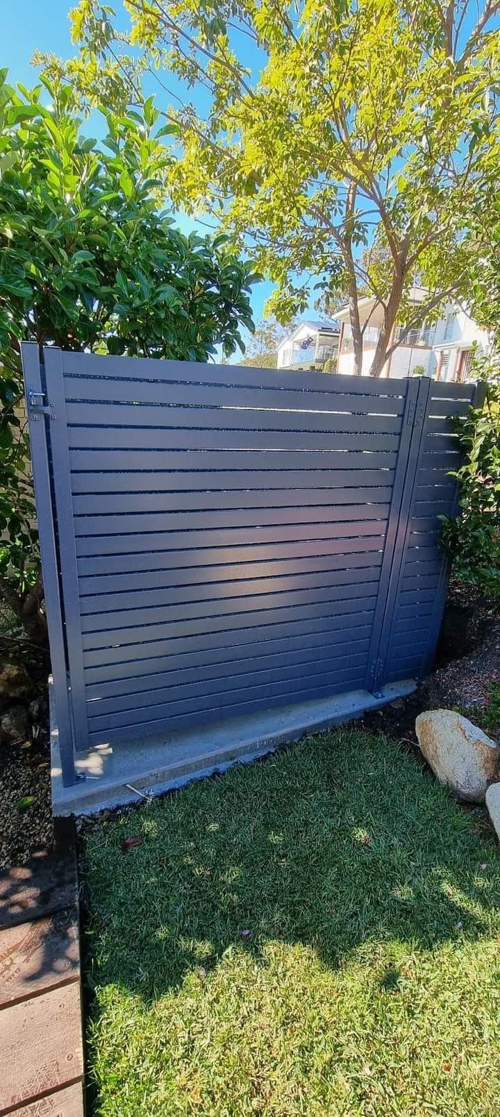 Gray Modern Fence With Slatted Design — Metal Fencing Supplies In Harrington, NSW