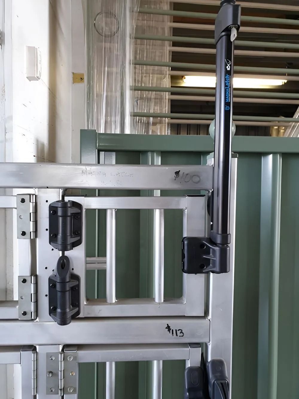 A Tall Metal Gate With a Black Sensor Attached to the Side — Metal Fencing Supplies In Taree, NSW