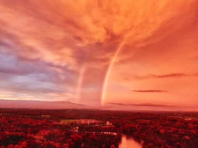 Aerial sunset photography by Hudson Valley Drones capturing a tornado in the sky over a river.