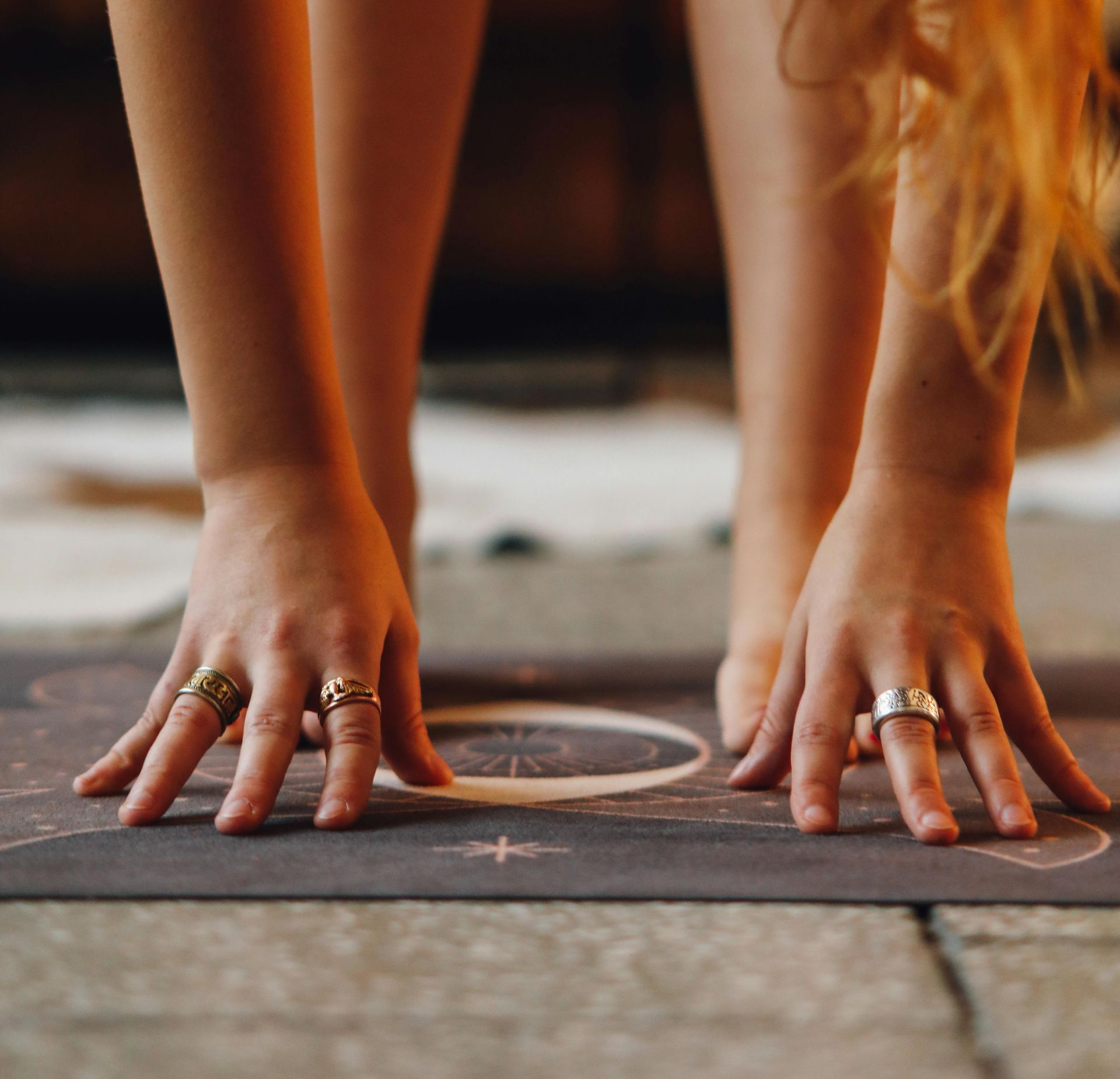 Woman folding towards the ground