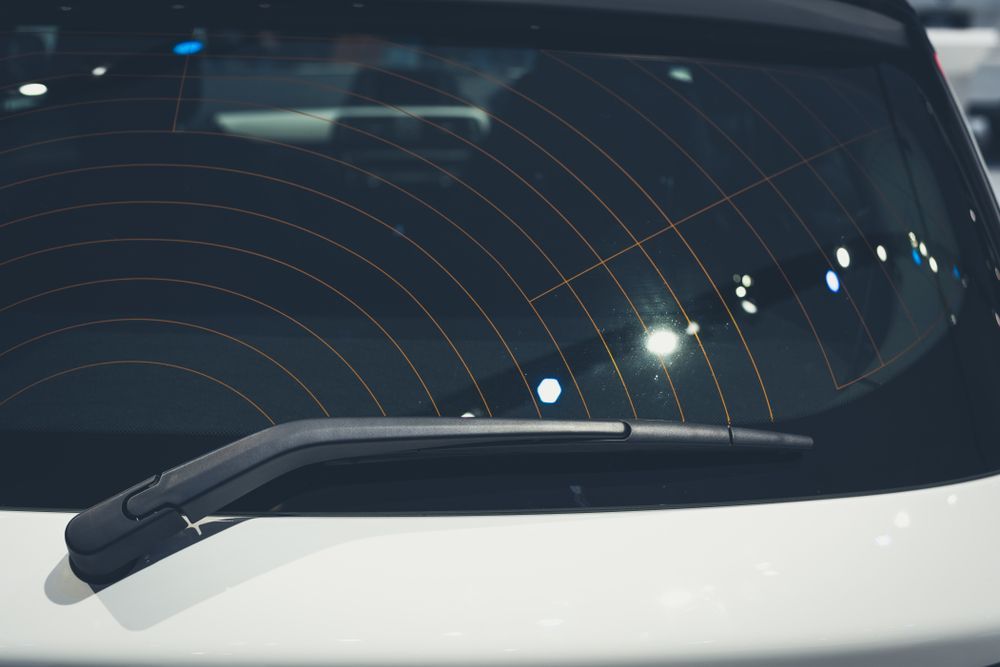 A Close Up of a Car Windshield With a Wiper Blade — Bendigo Windscreens In Bendigo, VIC