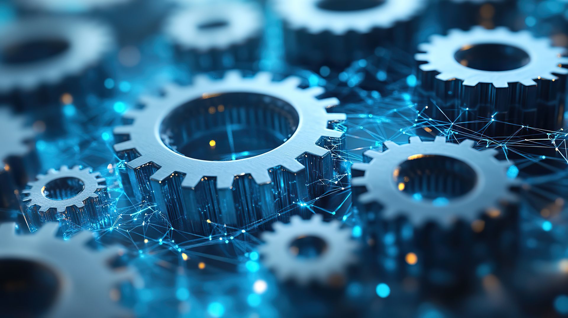 Close-up of gears interlocked with glowing blue light, suggesting technology or interconnected systems.