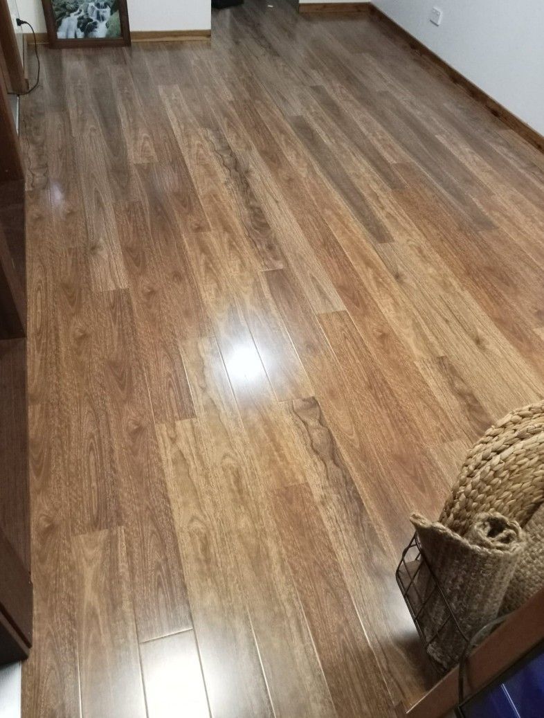 A Room With a Wooden Floor and a Basket on the Floor — BLB Flooring Solutions in Central Coast, NSW