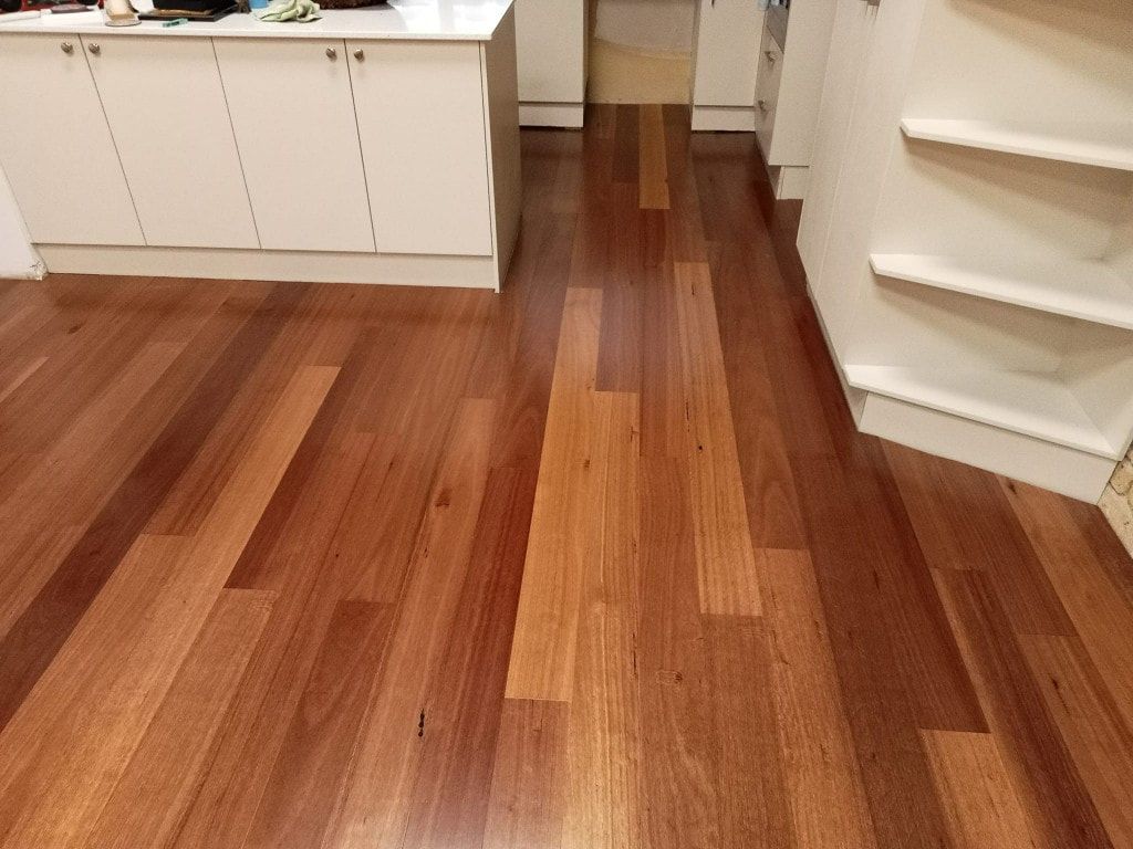 Wooden Floor With a Mix of Light and Dark Brown Planks — BLB Flooring Solutions in Newcastle, NSW