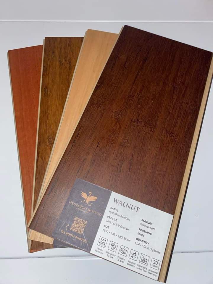 Four Pieces of Wood Are Stacked on Top of Each Other on a Table — BLB Flooring Solutions in Central Coast, NSW