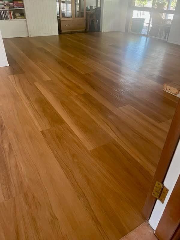 A Room With a Wooden Floor and a Door Leading to It — BLB Flooring Solutions in Central Coast, NSW
