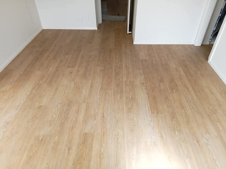 A Room With a Wooden Floor and White Walls — BLB Flooring Solutions in Central Coast, NSW