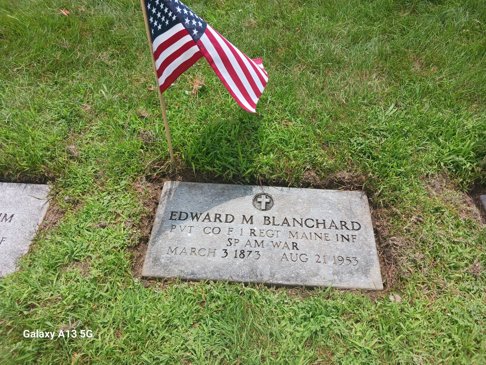 Grave of Edward M. Blanchard, marked with an American flag.