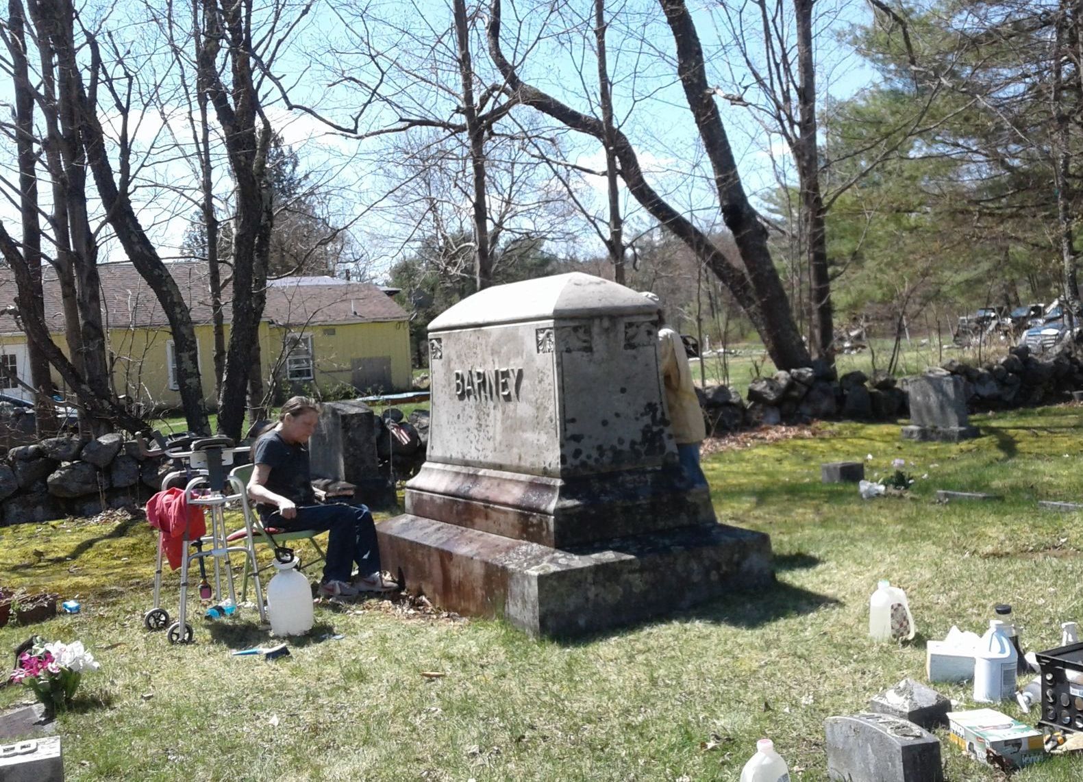Dirty family monument being cleaned by Aime Jacques
