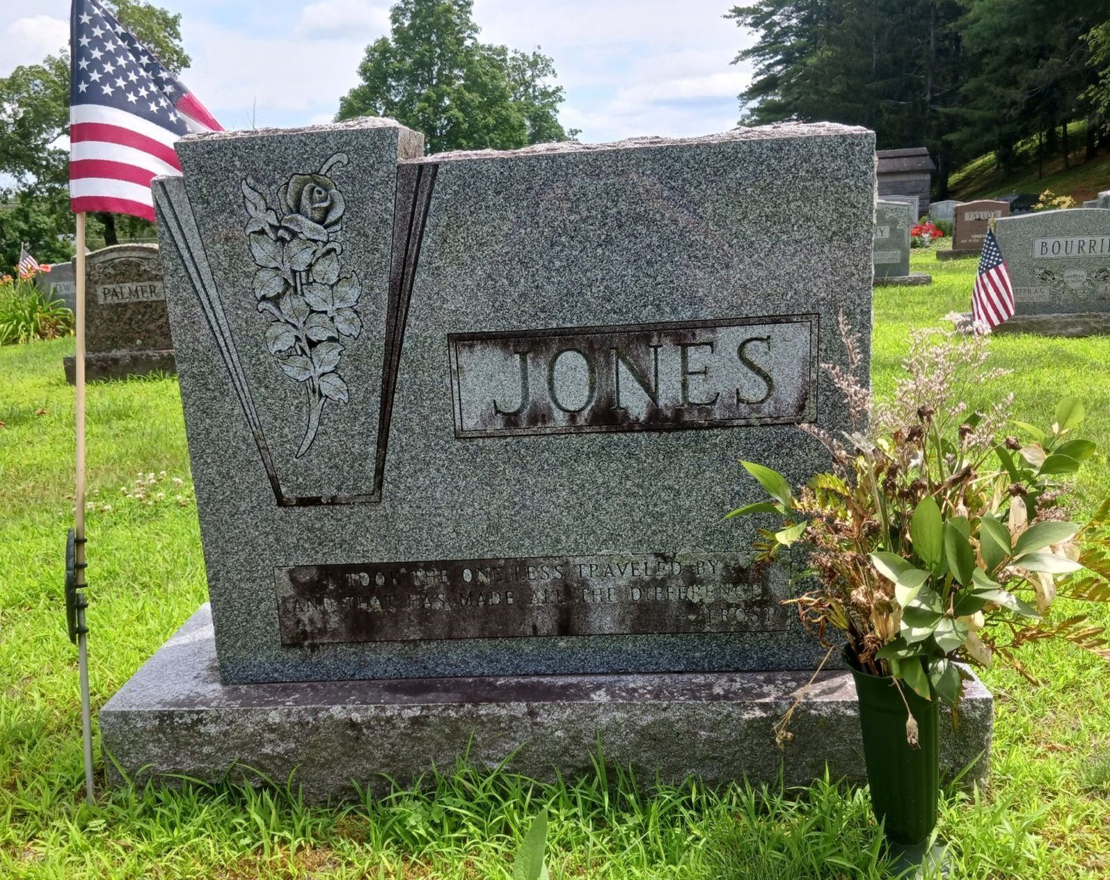 stained Jones family gravestone with illegible epitaph