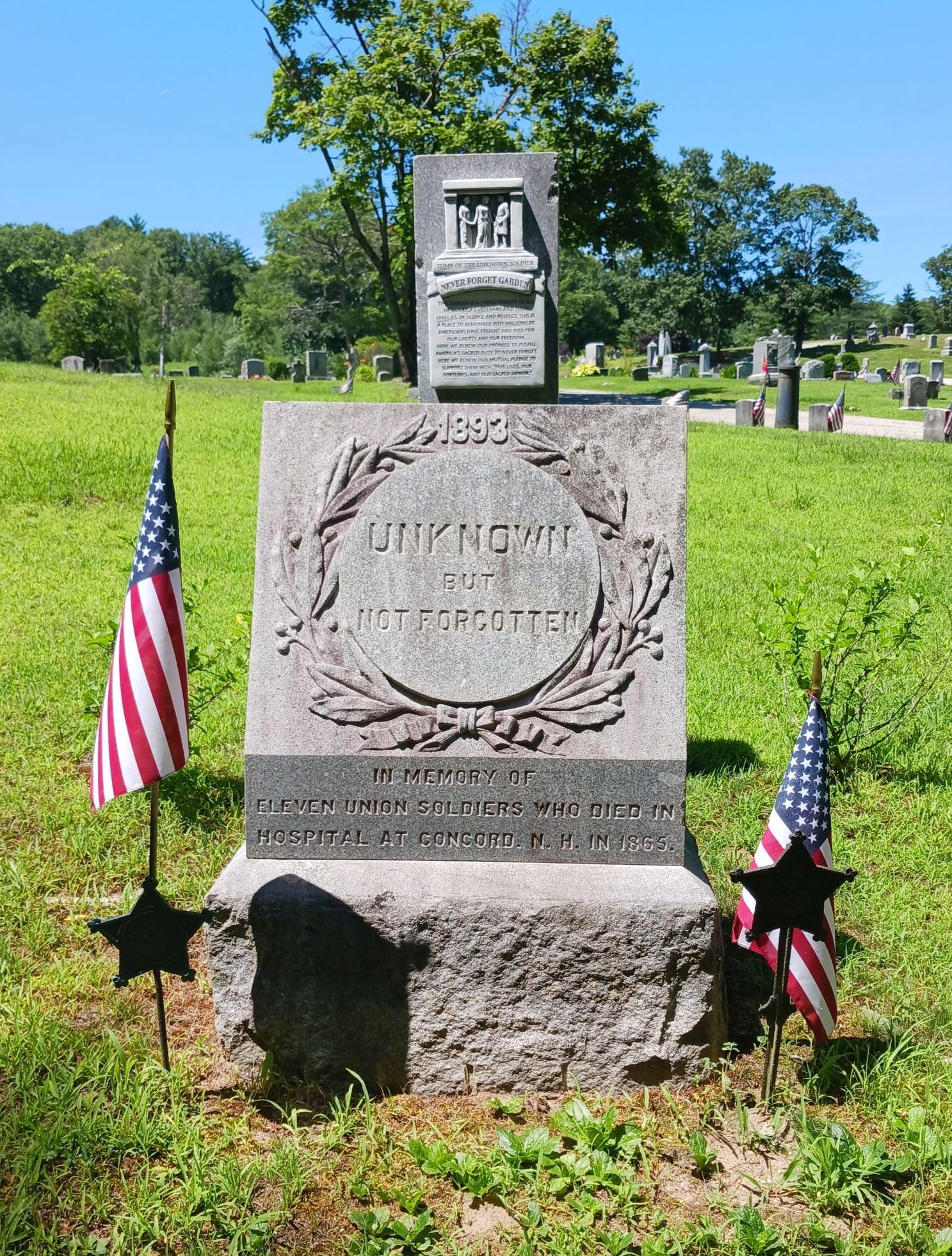 The monument has a carved wreath with the words