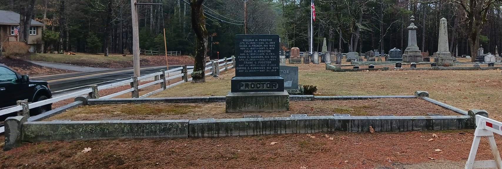 Proctor family monument with granite curbing before cleaning