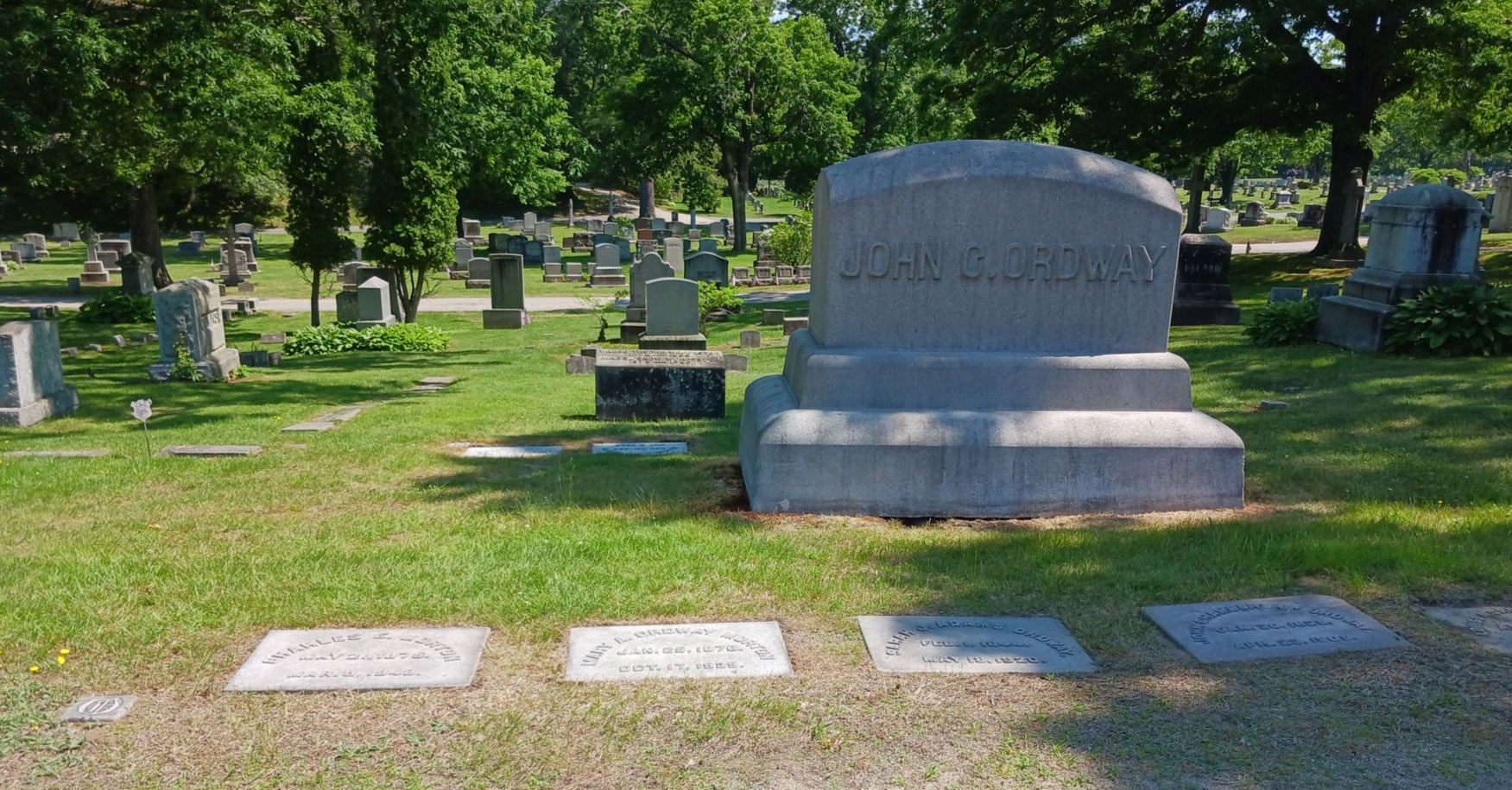 Very large granite monument and footstones after cleaning