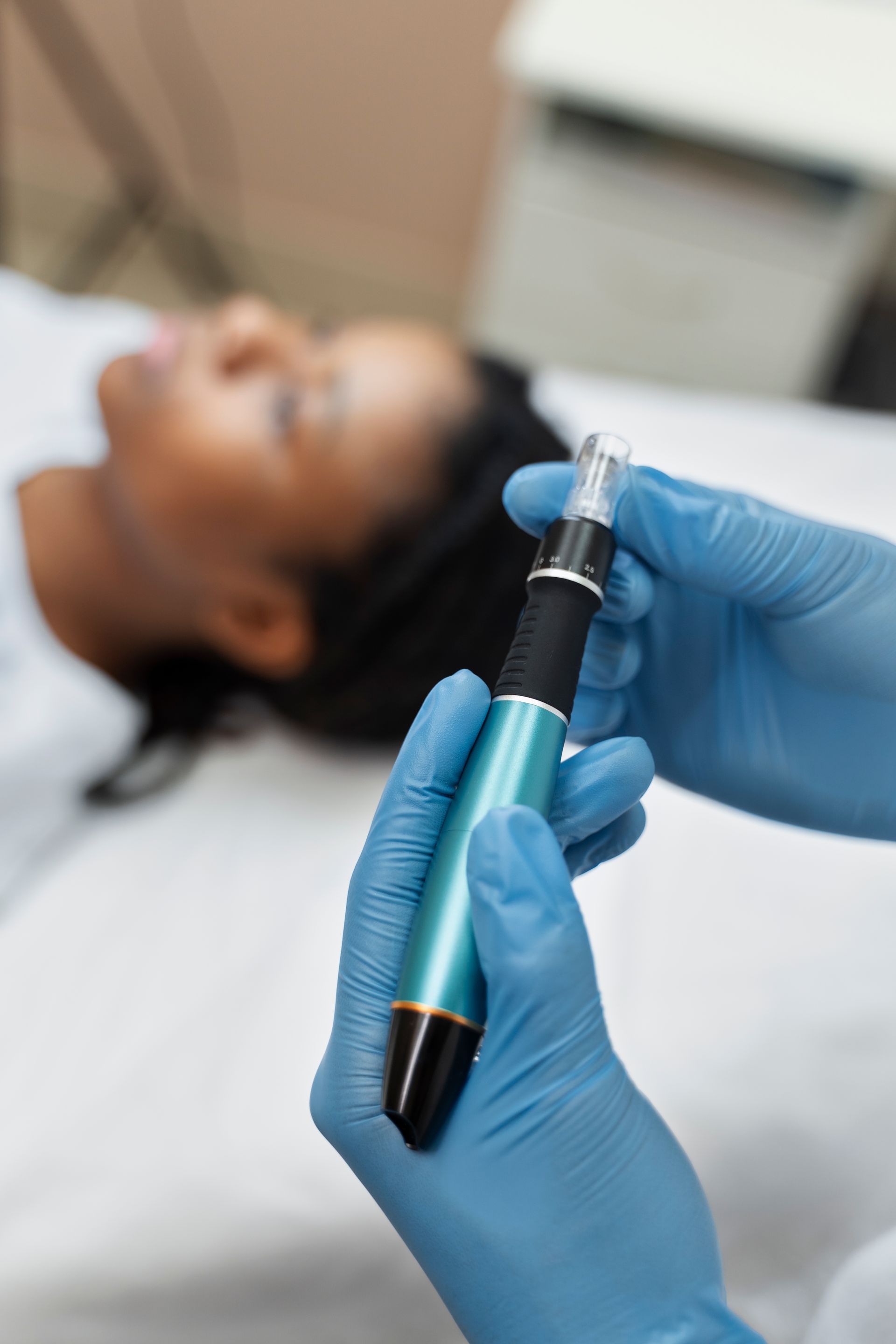 A woman is getting a botox treatment on her face.