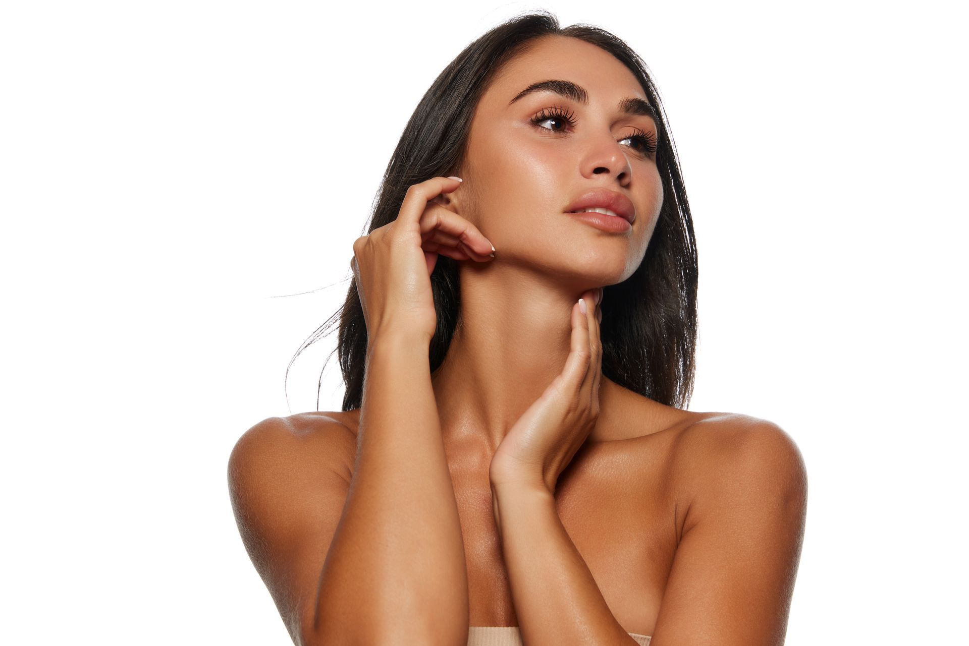 a woman touching her neck and cheek