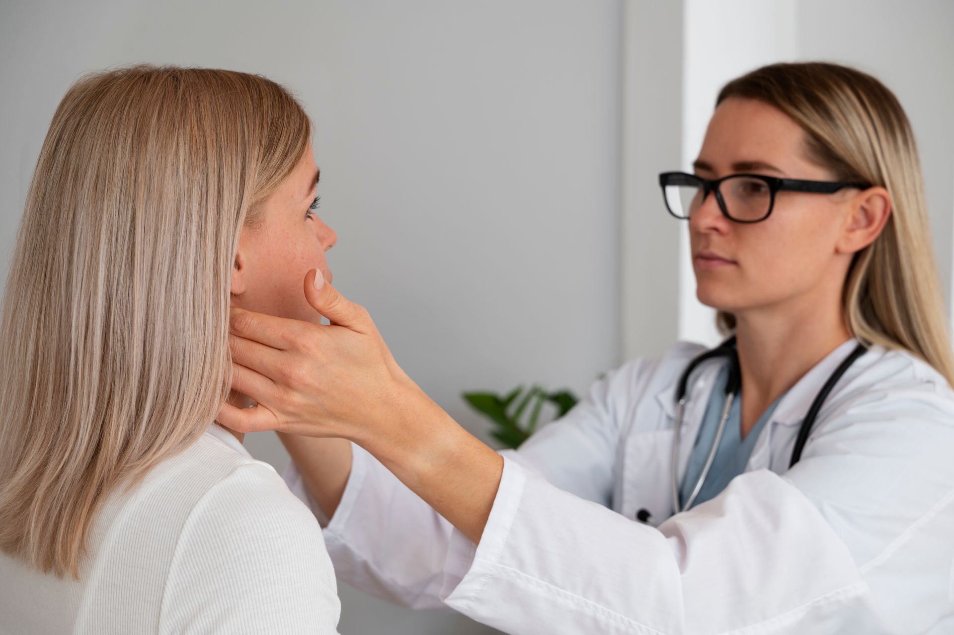 a professional examining a woman