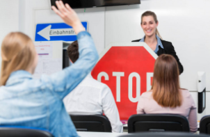 Driving school instructor teaching traffic rules