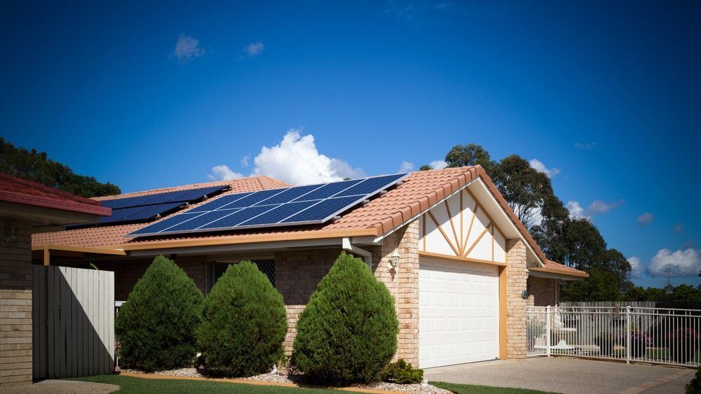 A House With Solar Panels On The Roof — Solar Power Whitsunday In Airlie Beach, QLD