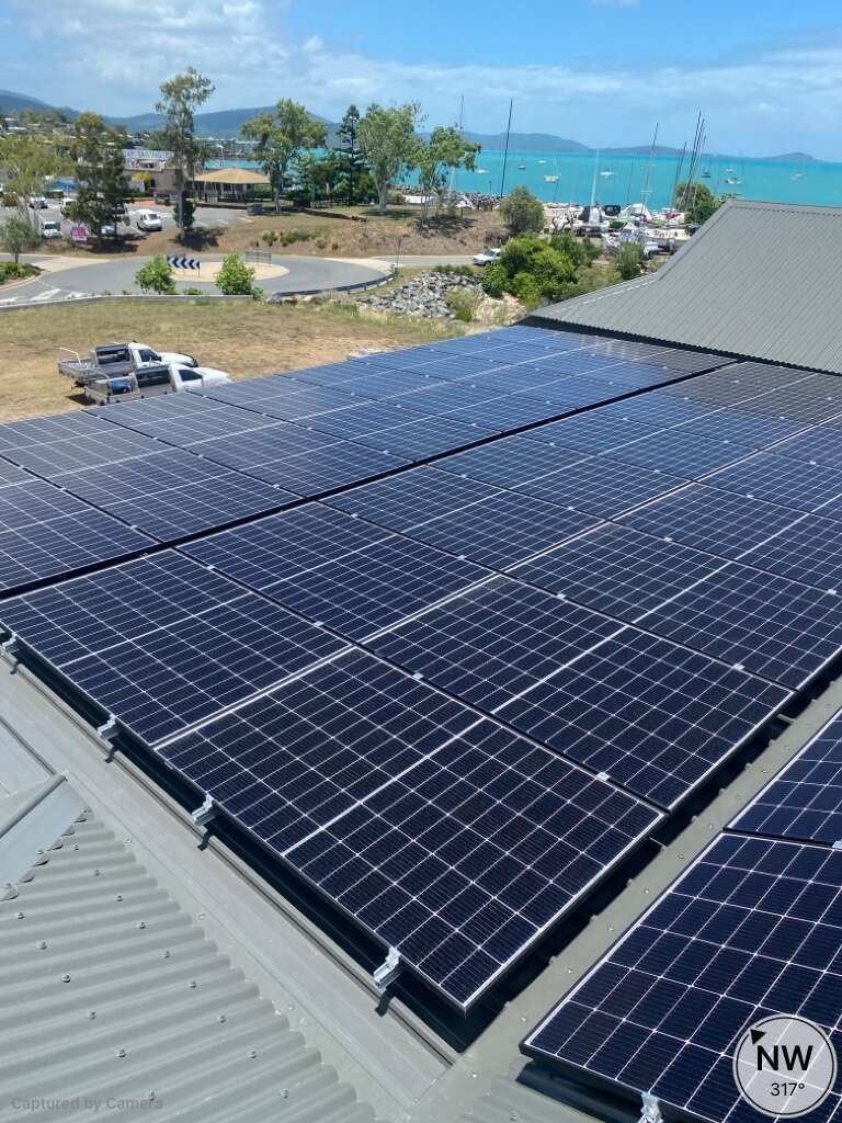There Are Many Solar Panels On The Roof Of A Building — Solar Power Whitsunday In Cannon Valley, QLD