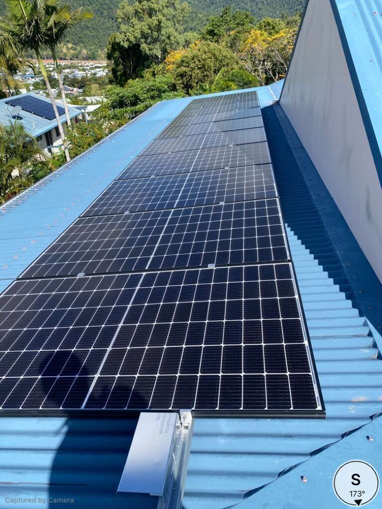 A Blue Roof With A Lot Of Solar Panels On It — Solar Power Whitsunday In Cannon Valley, QLD