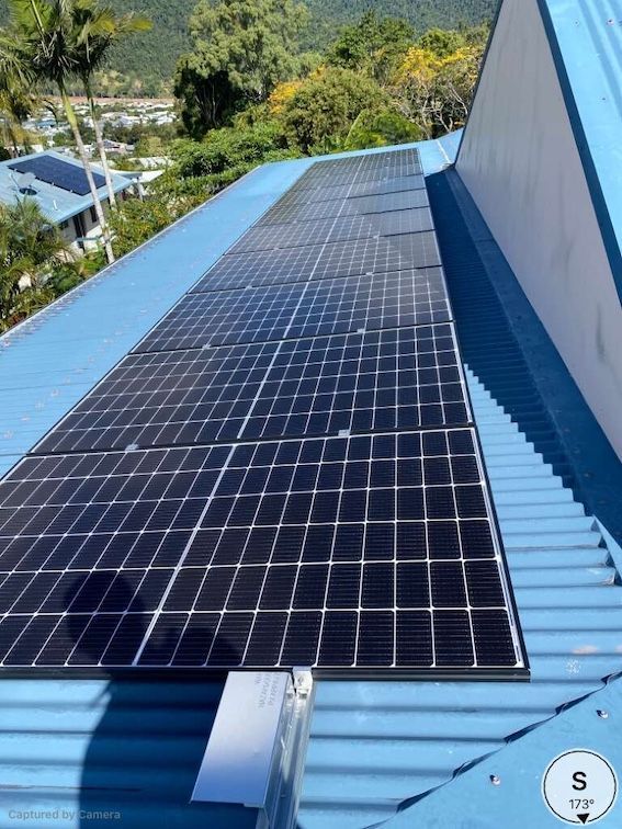 A Roof With Solar Panels On It — Solar Power Whitsunday In Cannonvale, QLD