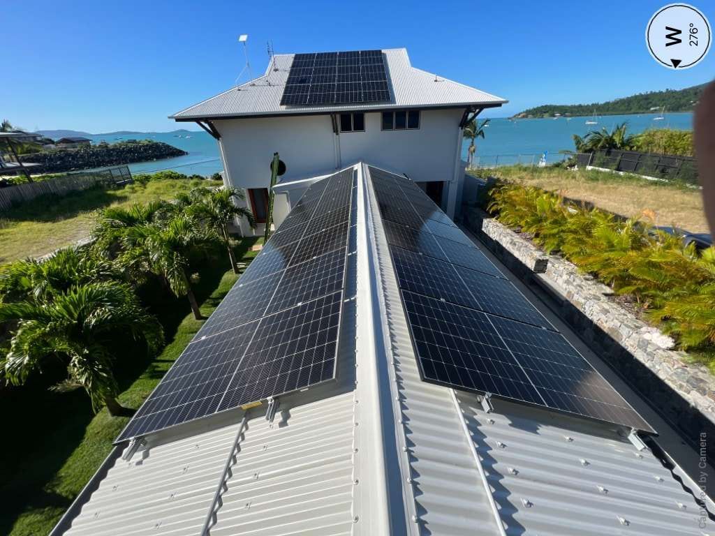A Large House With A Lot Of Solar Panels On The Roof — Solar Power Whitsunday In Airlie Beach, QLD