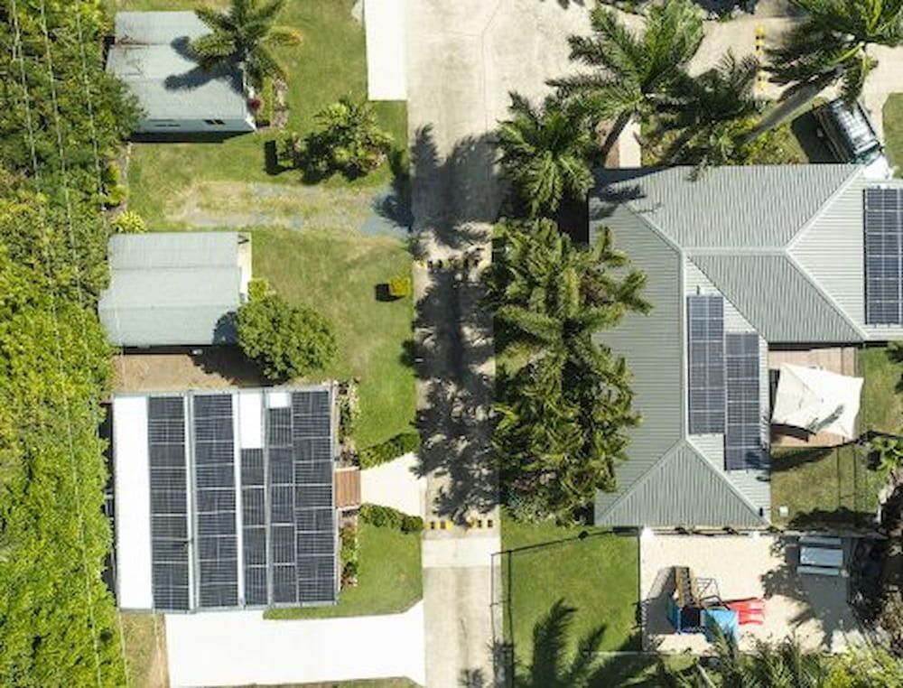 An Aerial View Of A House With Solar Panels On The Roof — Solar Power Whitsunday In Proserpine, QLD