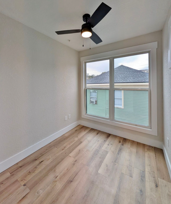 Ashley Lofts bedroom with hardwood floors and modern finishes