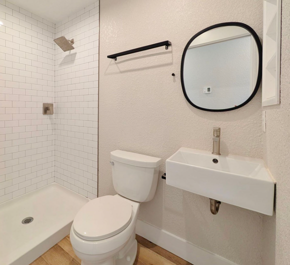 Ashley Lofts bathroom with hardwood floors and modern finishes