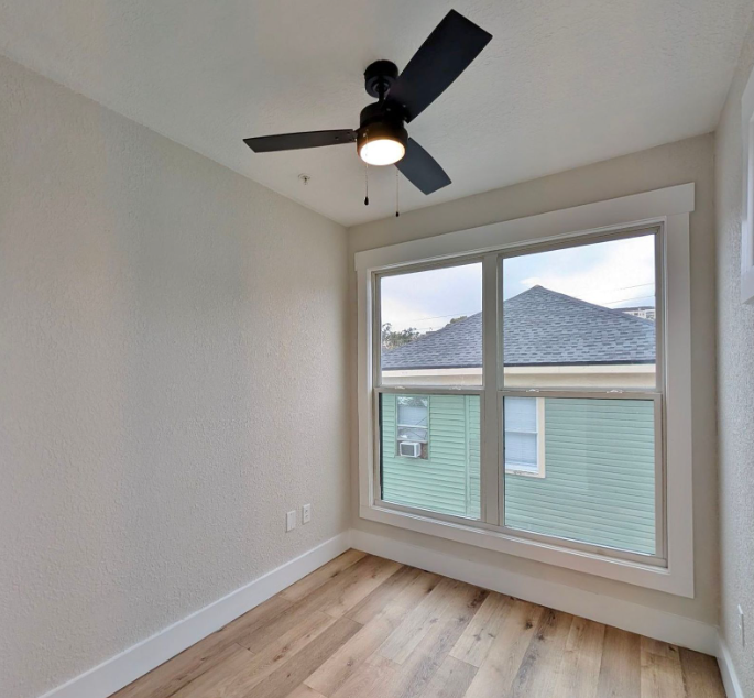 Ashley Lofts bedroom with hardwood floors and modern finishes