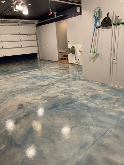 Orange and red metallic epoxy garage floor installed by 814 Epoxy Erie PA