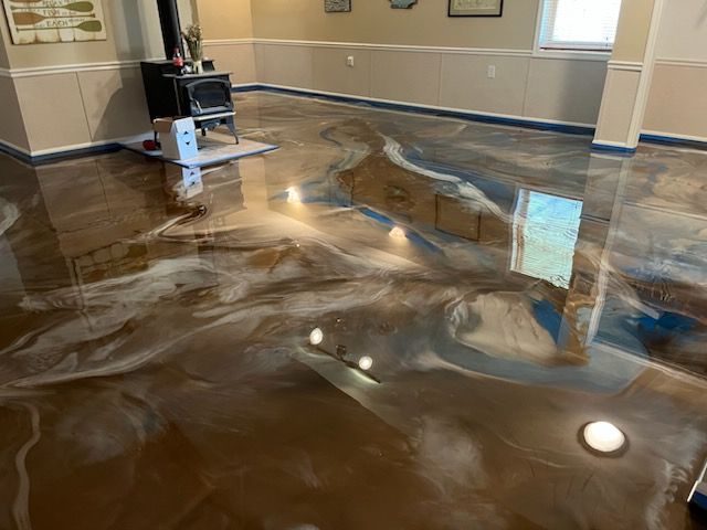 Brown and gold metallic epoxy floor with custom pattern by 814 Epoxy Erie PA